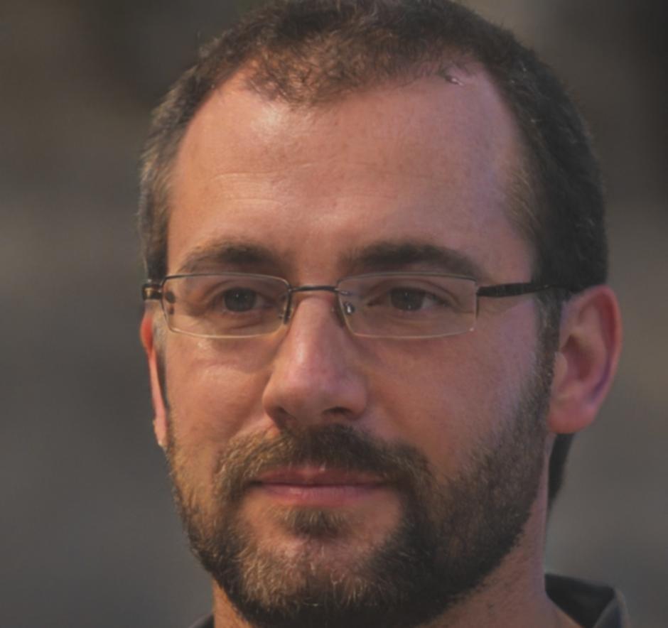 Professional headshot of Aleksander Novak