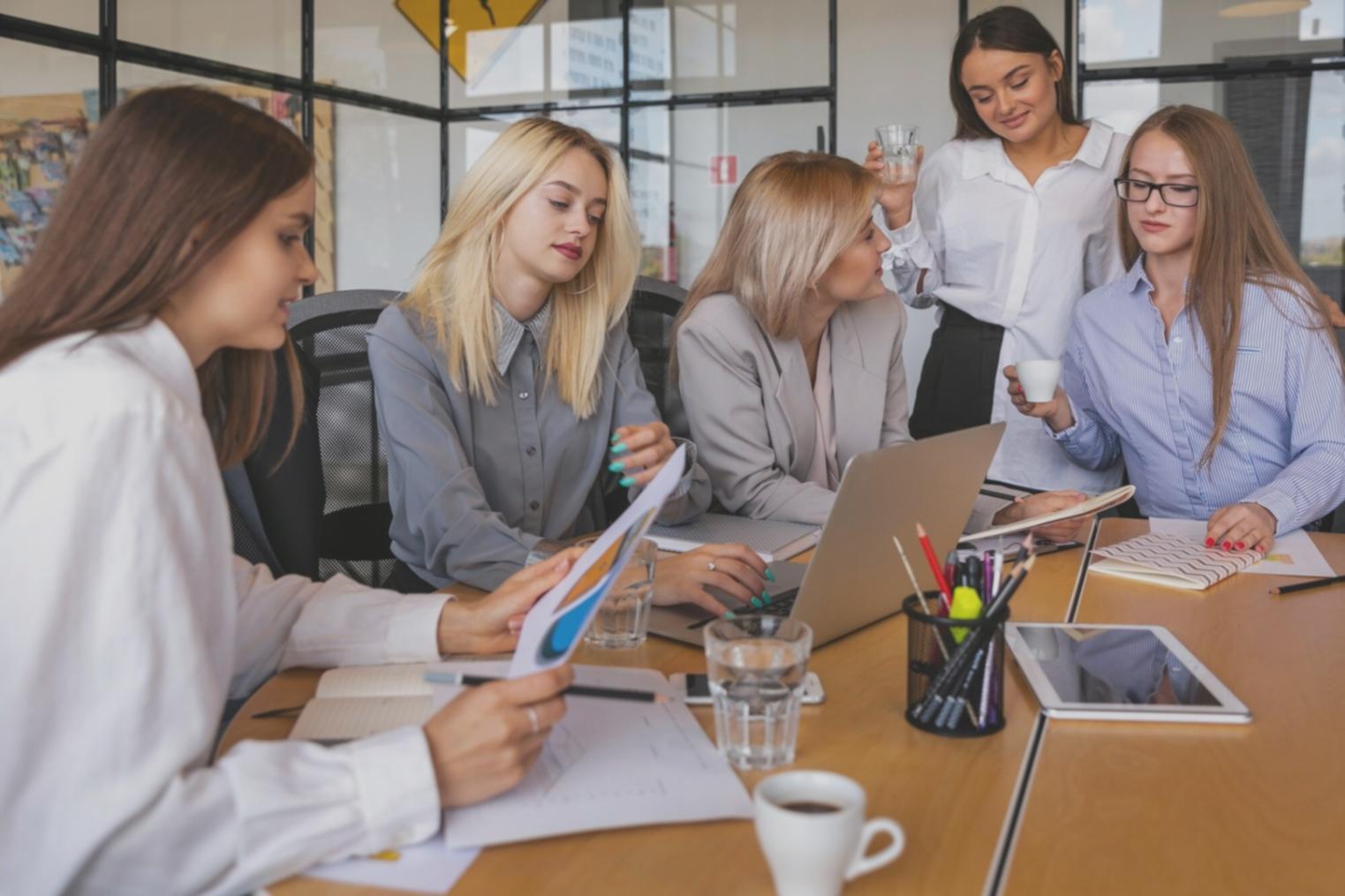 Email marketing campaign planning session with analytics dashboard and strategy documents